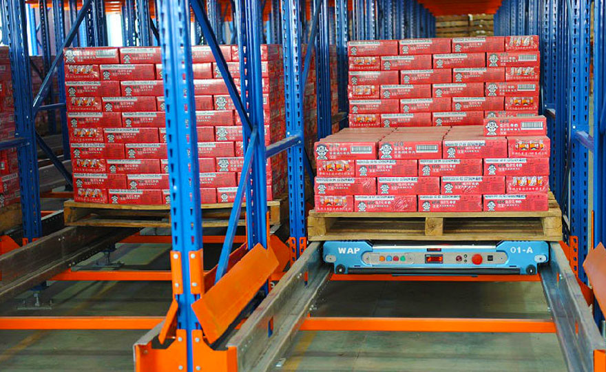 What type of semi-automatic operation is performed on the beverage warehouse shelves?