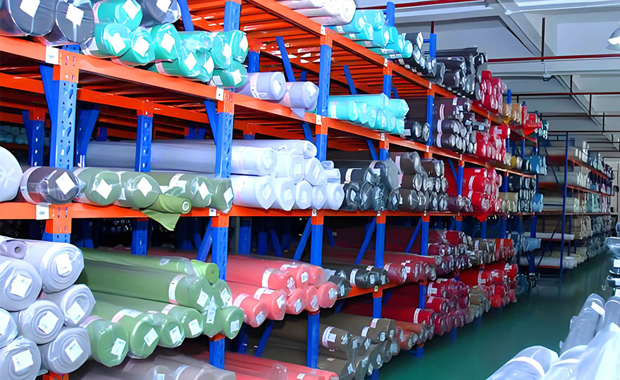 Are the goods in the fabric warehouse shelves accessed by humans or by forklifts?