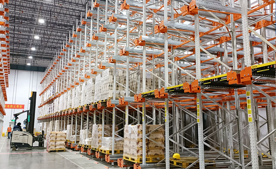What types of warehouse shelves with densely packed storage positions are used in cold storage facilities?